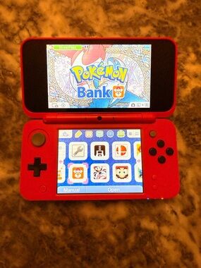 New Nintendo 2DS XL Pokeball Edition With Pokémon Bank, Poke Transporter & Games